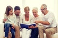 Happy family with book or photo album at home Royalty Free Stock Photo