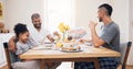 Happy family, breakfast and eat together for brunch while sitting around the dining table in their home. Man, father and Royalty Free Stock Photo