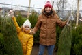 Happy family buying christmas tree at market Royalty Free Stock Photo