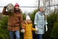 Happy family buying christmas tree at market Royalty Free Stock Photo