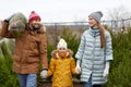 Happy family buying christmas tree at market Royalty Free Stock Photo