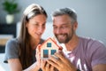 Happy Family Buying New House. Couple With Real Estate Royalty Free Stock Photo