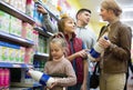 Happy family buying pasteurized milk