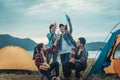 Happy family on a camping trip relaxing by their tent Royalty Free Stock Photo