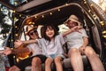 Happy Family with car travel and camping road trip. summer vacation in car in the sunset, Dad, mom and daughter happy traveling Royalty Free Stock Photo