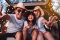 Happy Family with car travel and camping road trip. summer vacation in car in the sunset, Dad, mom and daughter happy traveling Royalty Free Stock Photo