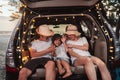 Happy Family with car travel and camping road trip. summer vacation in car in the sunset, Dad, mom and daughter happy traveling Royalty Free Stock Photo