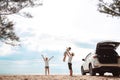 Happy Family with car travel road trip. summer vacation in car in the sunset, Dad, mom and daughter happy traveling enjoy together Royalty Free Stock Photo