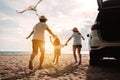 Happy Family with car travel road trip. summer vacation in car in the sunset, Dad, mom and daughter happy traveling enjoy together Royalty Free Stock Photo