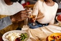 Happy family celebrate Thanksgiving day, sitting at table with roasted turkey and holiday traditional food, dishes Royalty Free Stock Photo