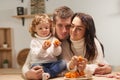 Happy family celebrates Christmas in the kitchen, love, sincerity and warmth