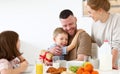 Happy family celebrating Fathers day together while having breakfast in kitchen at home Royalty Free Stock Photo