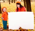 Happy family, child on autumn orange leaf, banner