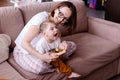 Happy family with a child with cerebral palsy. The mother and her disabled son