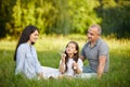 Happy family with child girl blow soap bubbles Royalty Free Stock Photo