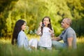 Happy family with child girl blow soap bubbles Royalty Free Stock Photo