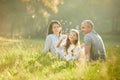 Happy family with child girl blow soap bubbles Royalty Free Stock Photo