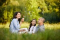 Happy family with child girl blow soap bubbles Royalty Free Stock Photo