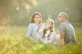 Happy family with child girl blow soap bubbles Royalty Free Stock Photo