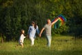 Happy family with child girl launches kites Royalty Free Stock Photo