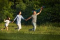 Happy family with child girl launches kites Royalty Free Stock Photo