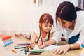 Happy family child kid girl kindergarten drawing teacher education mother mom with beautiful mother