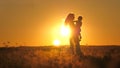 Happy family child and mother playing together at sunset silhouette. people in the park concept mom daughter joyful Royalty Free Stock Photo