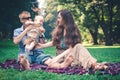 A happy family with child resting outdoors