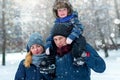 Happy family with a child in winter. Beautiful, romantic atmosphere on a snowy winter day. The concept of relationships Royalty Free Stock Photo