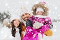 Happy family with child in winter clothes outdoors Royalty Free Stock Photo