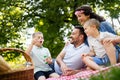 Family with children blow soap bubbles outdoors Royalty Free Stock Photo