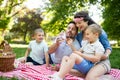 Family with children blow soap bubbles outdoors Royalty Free Stock Photo