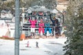 Happy family with ski lift climb up on ski terrain Royalty Free Stock Photo