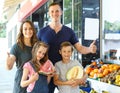 Happy family with children demostration fruits Royalty Free Stock Photo