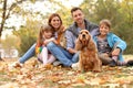 Happy family with children and dog in park Royalty Free Stock Photo