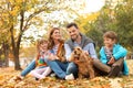 Happy family with children and dog in park Royalty Free Stock Photo