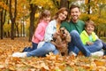 Happy family with children and dog in park Royalty Free Stock Photo