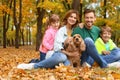 Happy family with children and dog in park Royalty Free Stock Photo