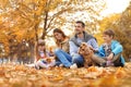 Happy family with children and dog in park Royalty Free Stock Photo