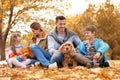 Happy family with children and dog in park Royalty Free Stock Photo