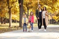 Happy family with children and dog in park. Royalty Free Stock Photo