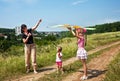 Happy family and children fly kite. Royalty Free Stock Photo