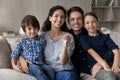 Happy family with children holding keys from new house