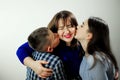 Daughter Girl 16 18 years Boy 12-15 Children from 2 sides kisses mom Happy family children kiss mom from two sides. Sons Royalty Free Stock Photo