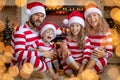 Happy family with children near fireplace at Christmas Royalty Free Stock Photo