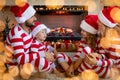 Happy family with children near fireplace at Christmas Royalty Free Stock Photo