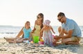 Happy family with children playing on summer beach Royalty Free Stock Photo