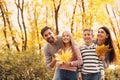 Happy family with children spending time. Autumn walk Royalty Free Stock Photo