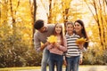 Happy family with children spending time. Autumn walk Royalty Free Stock Photo