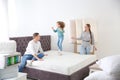 Family choosing mattress in furniture store Royalty Free Stock Photo
